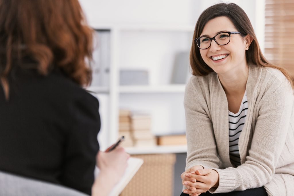Woman speaking with a therapist.