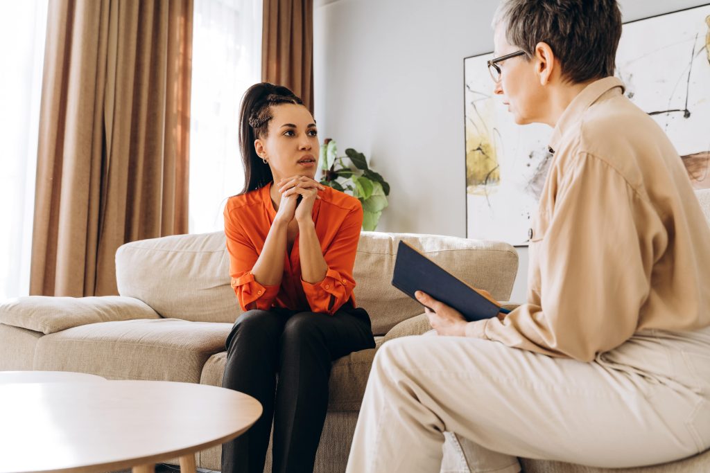 Woman speaking with a counselor.